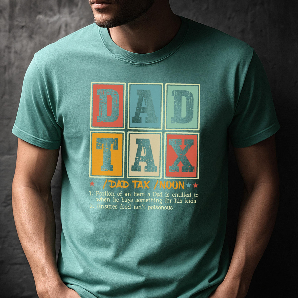 May include: Teal t-shirt with the text "DAD TAX" in a retro, colorful design. The shirt includes a definition of "DAD TAX" and its purpose. A fun and humorous gift idea.