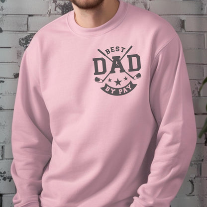 May include: A light pink sweatshirt with a black graphic that reads "BEST DAD BY PAY". The design includes crossed golf clubs and stars. The sweatshirt is a crew neck style.