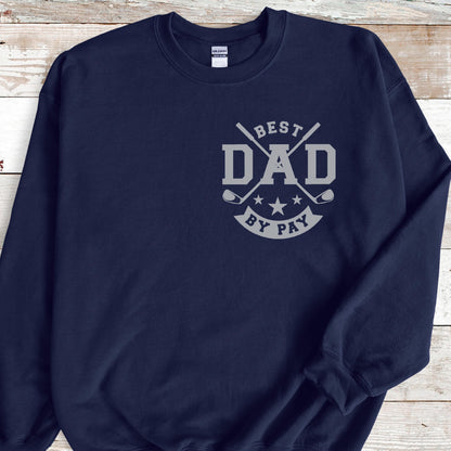 May include: Navy blue sweatshirt with the text "BEST DAD BY PAY" in gray. The design includes golf clubs and stars. The sweatshirt is a comfortable, casual garment.