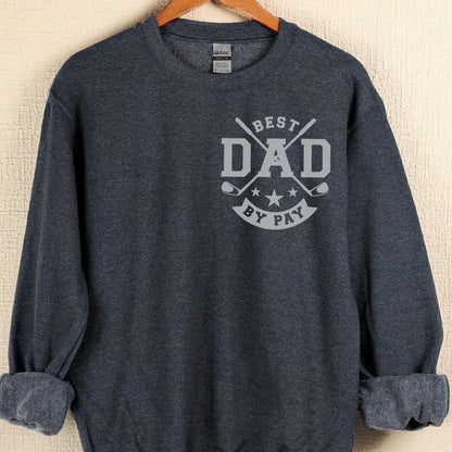 May include: A navy blue sweatshirt with the text "BEST DAD BY PAY" in gray. The design includes crossed golf clubs and stars. The sweatshirt is hanging on a wooden hanger.