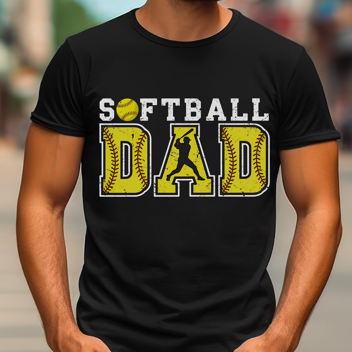 May include: Black t-shirt with the text "Softball Dad" in yellow and white. A yellow softball and a silhouette of a softball player are included in the design.