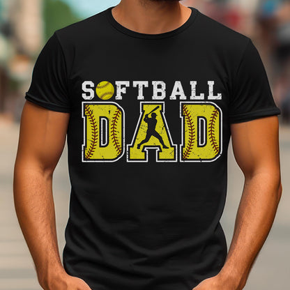 May include: Black t-shirt with the text "Softball Dad" in yellow and white. A yellow softball and a silhouette of a softball player are included in the design.