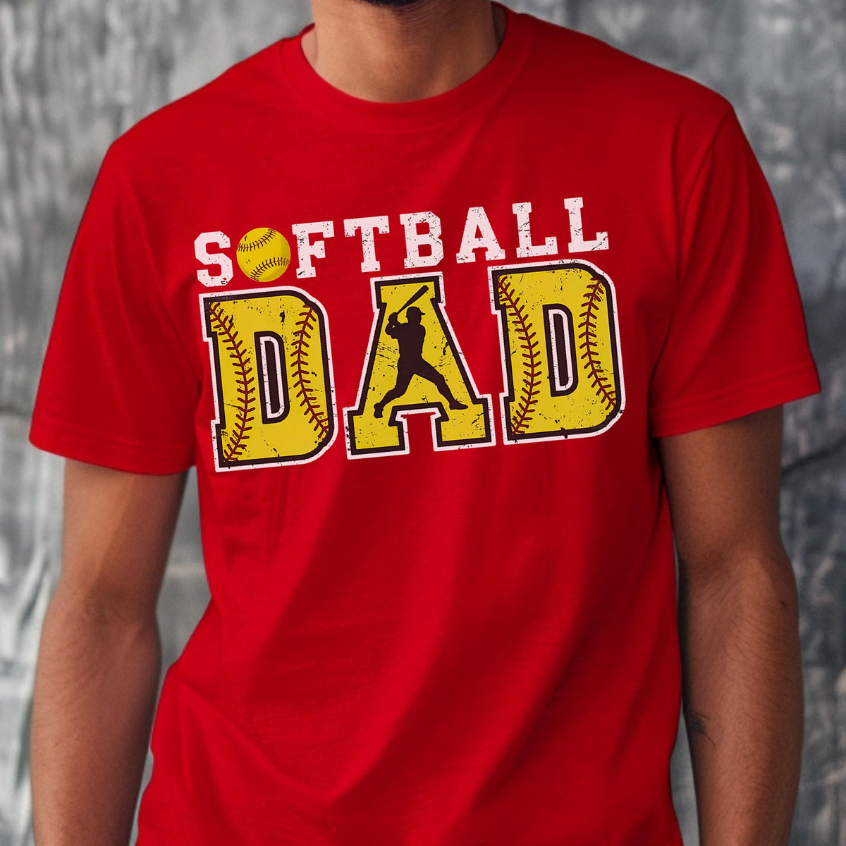 May include: Red t-shirt with the text "Softball Dad" in white letters with a yellow softball graphic and a silhouette of a softball player.