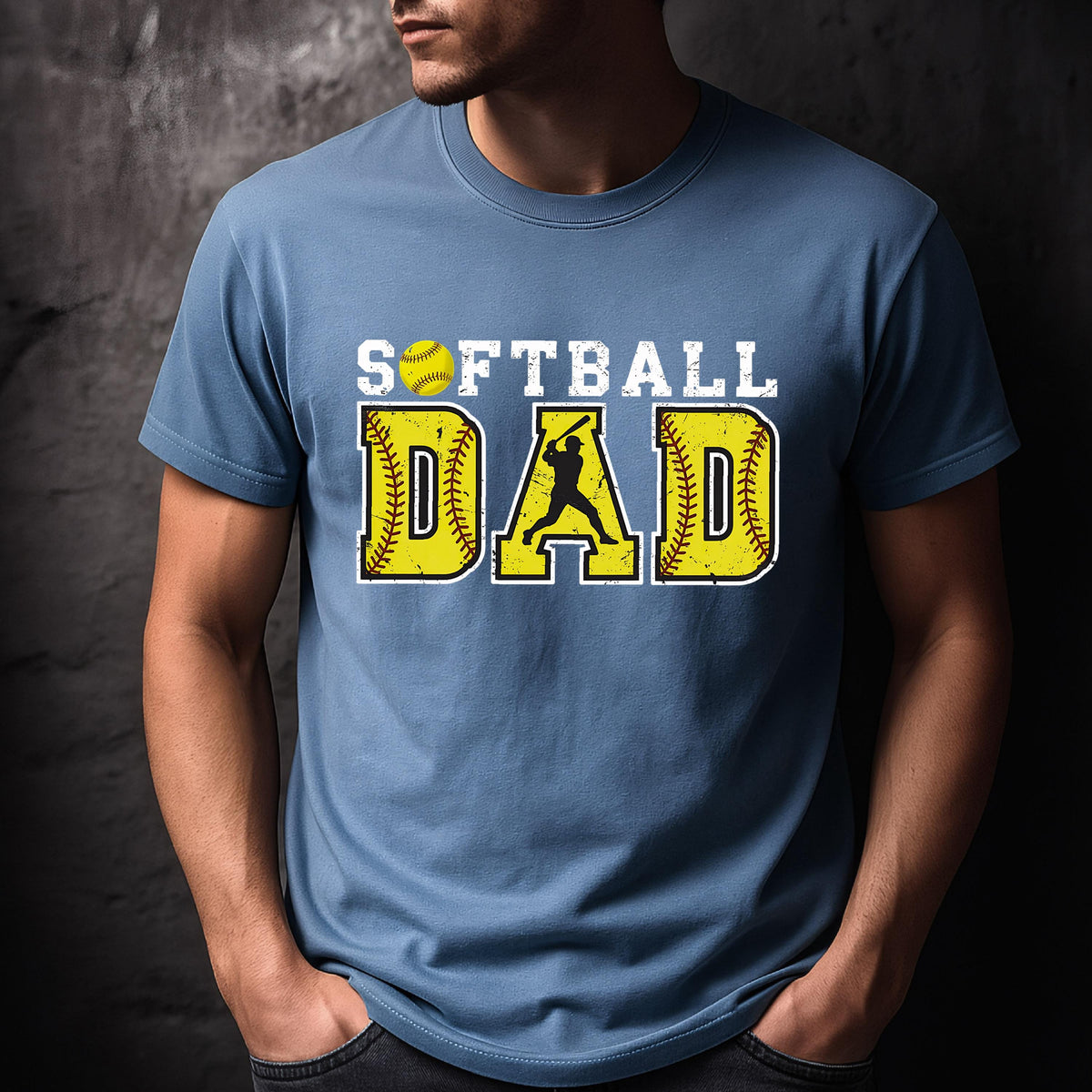 May include: A blue t-shirt with the text "Softball Dad" in yellow and white letters. A yellow softball with white stitching and a silhouette of a softball player are included in the design.