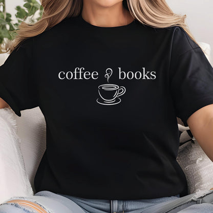 May include: Black t-shirt with the words "coffee & books" in white, along with a white line drawing of a coffee cup and saucer. The shirt is a casual style, suitable for everyday wear.