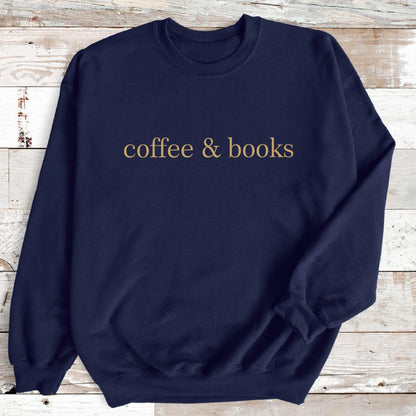 May include: A navy blue sweatshirt with the text "coffee & books" printed in gold on the front.
