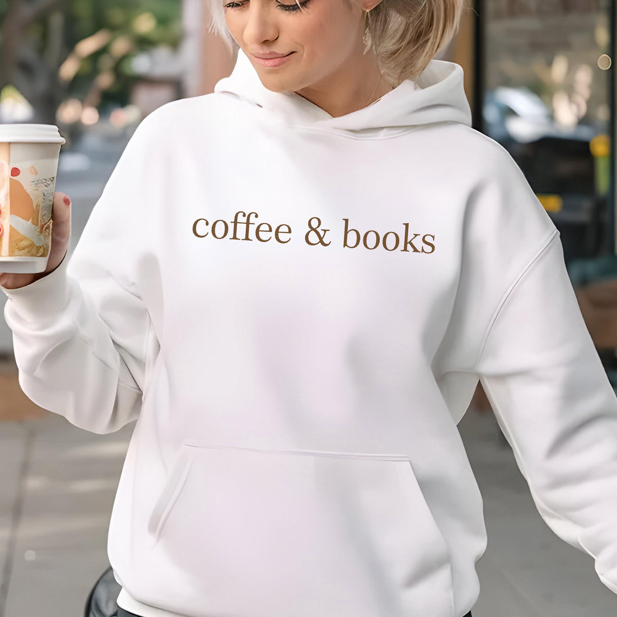 May include: White hoodie with a brown text print that says "coffee & books".