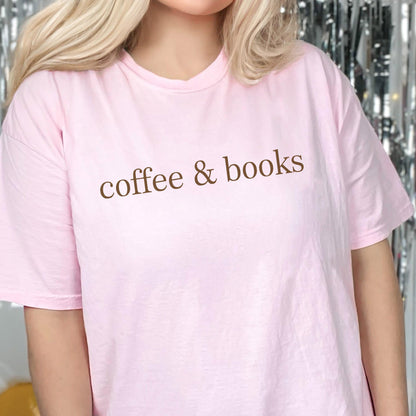 May include: A pink t-shirt with the text "coffee & books" printed in brown on the front.