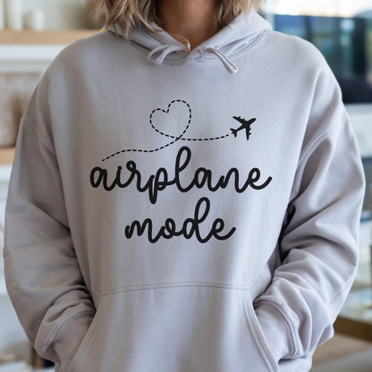 May include: A light gray hooded sweatshirt featuring a black graphic print on the chest. The design includes a dashed line forming a heart shape, a small airplane silhouette, and the text "airplane mode" written in a cursive script font.