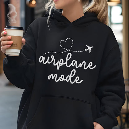 May include: A black hooded sweatshirt featuring a white graphic print on the chest. The design includes a dashed line forming a heart shape, a small airplane icon, and the text "airplane mode" written in a white cursive script font.