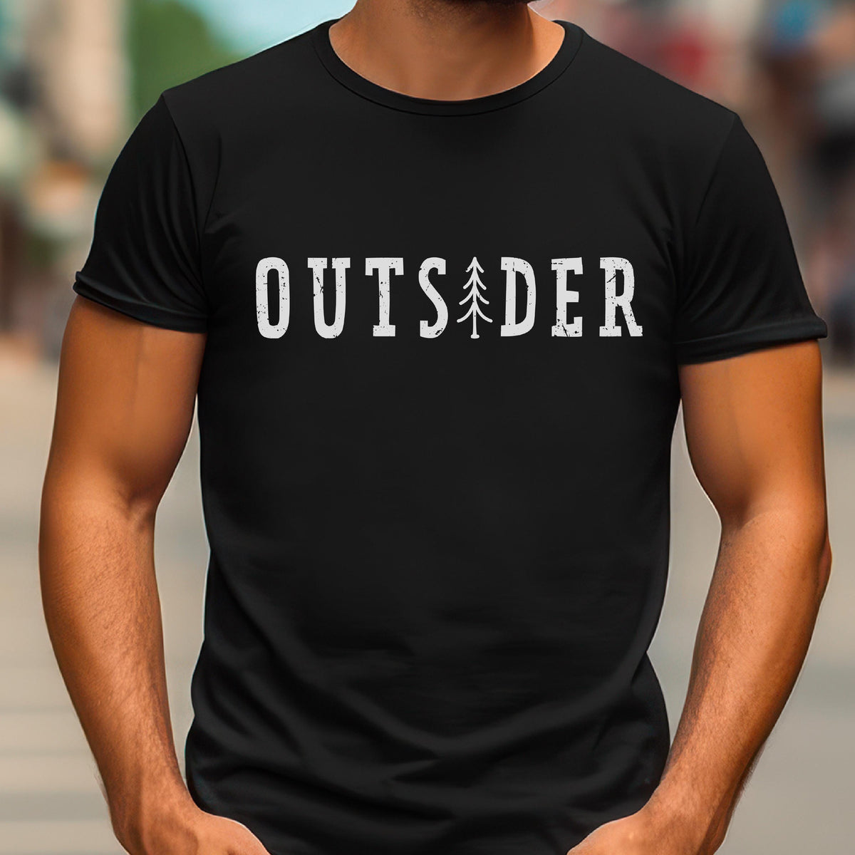 May include: A black short-sleeved t-shirt featuring the white distressed-style text OUTSIDER printed across the chest. The letter I is replaced by a stylized white graphic of a pine tree. The shirt has a crew neckline and a standard fit.