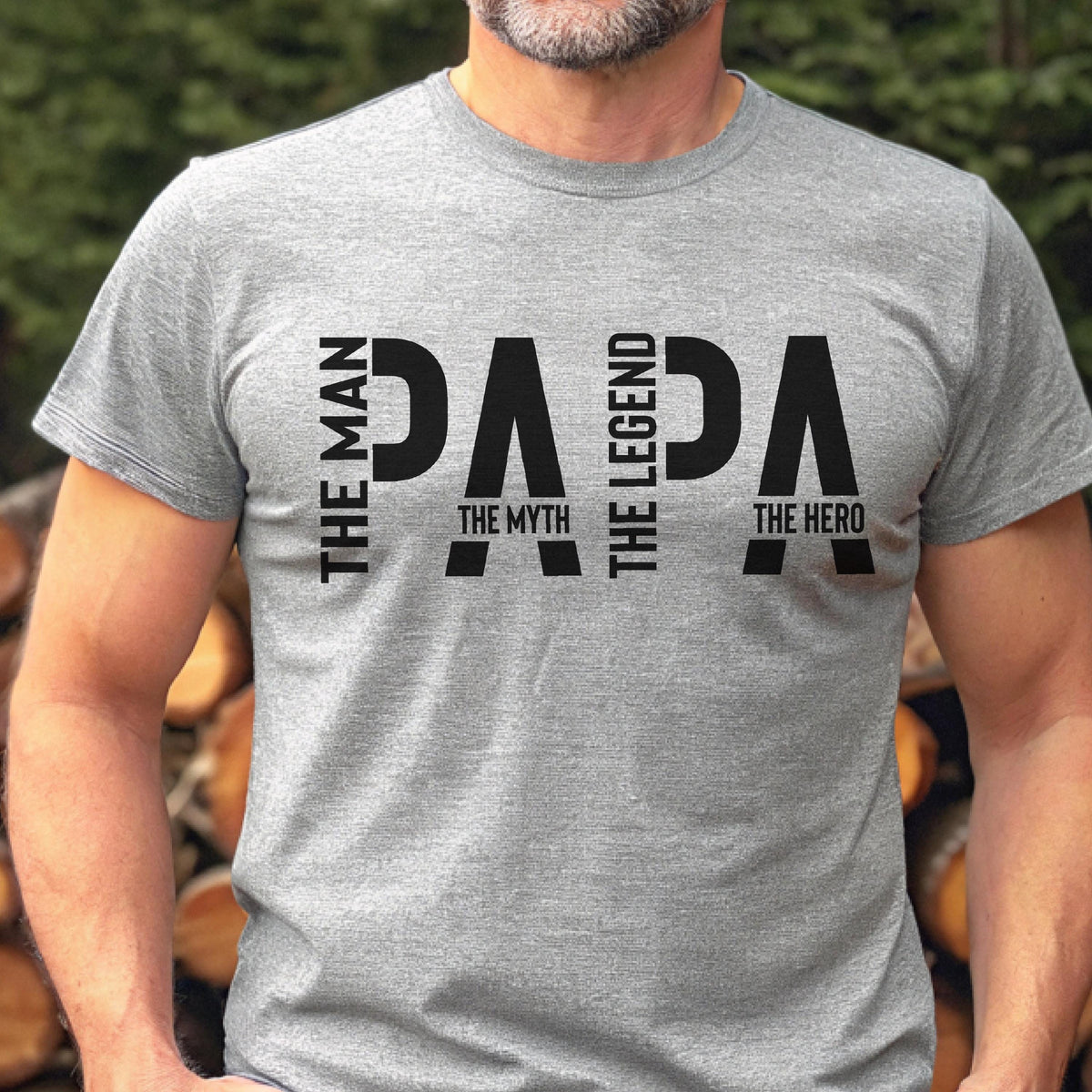 May include: A gray t-shirt with the word "PAPA" in large black letters. The words "THE MAN", "THE MYTH", "THE LEGEND", and "THE HERO" are printed vertically on the shirt.