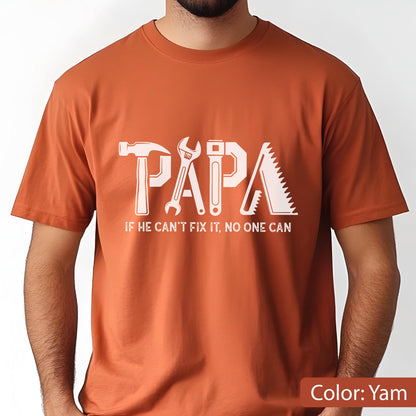 May include: A yam-colored t-shirt with the word "PAPA" in white, designed with tool graphics. Below the word is the text "IF HE CAN'T FIX IT, NO ONE CAN."