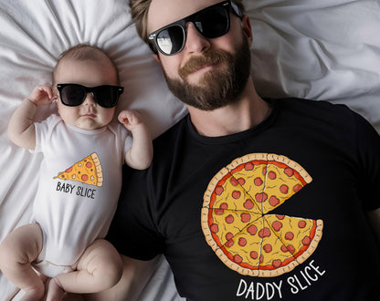 May include: A baby wearing sunglasses and a white onesie with a pizza slice graphic and the text "Baby Slice." A man wearing sunglasses and a black t-shirt with a pizza graphic and the text "Daddy Slice."