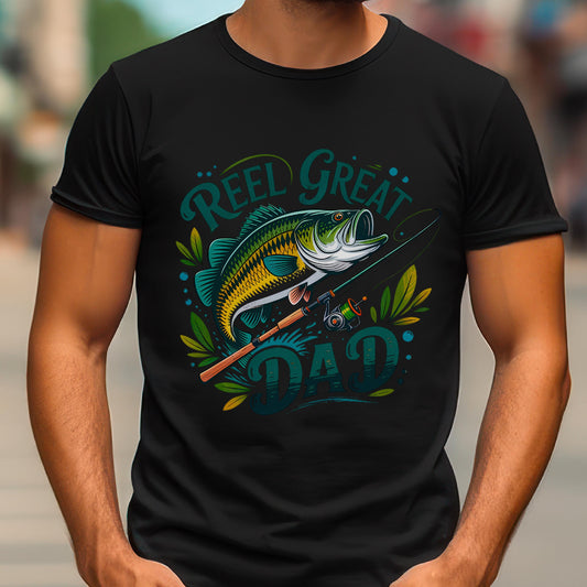 May include: Black t-shirt with a colorful graphic featuring a fish, fishing rod, and the words "Reel Great Dad" in teal and green. The design includes decorative leaves and dots, perfect for a fishing enthusiast.