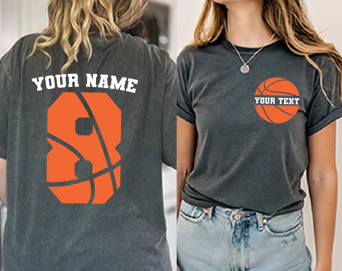 May include: A charcoal gray t-shirt featuring a basketball graphic on the front left chest with the text YOUR TEXT and a large orange number 8 basketball graphic on the back with the text YOUR NAME printed in white above the number.