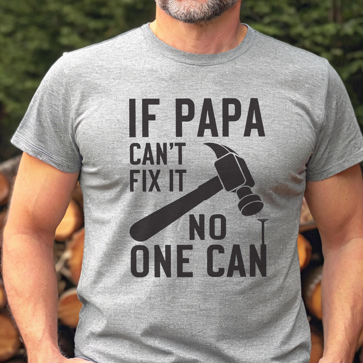 May include: A gray t-shirt with the text "IF PAPA CAN'T FIX IT NO ONE CAN" in black. A black hammer and nail graphic is featured below the text. The shirt is short-sleeved.