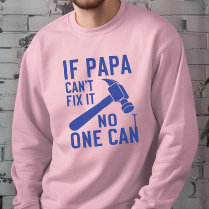 May include: A light pink sweatshirt with the text "IF PAPA CAN'T FIX IT NO ONE CAN" in blue. A blue hammer and nail graphic are also featured on the front of the sweatshirt.