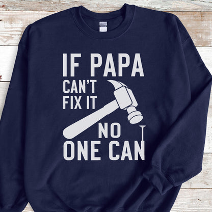 May include: Navy blue sweatshirt with the text "IF PAPA CAN'T FIX IT NO ONE CAN" in white, along with a white hammer graphic. The sweatshirt is a solid color and has a crew neck.