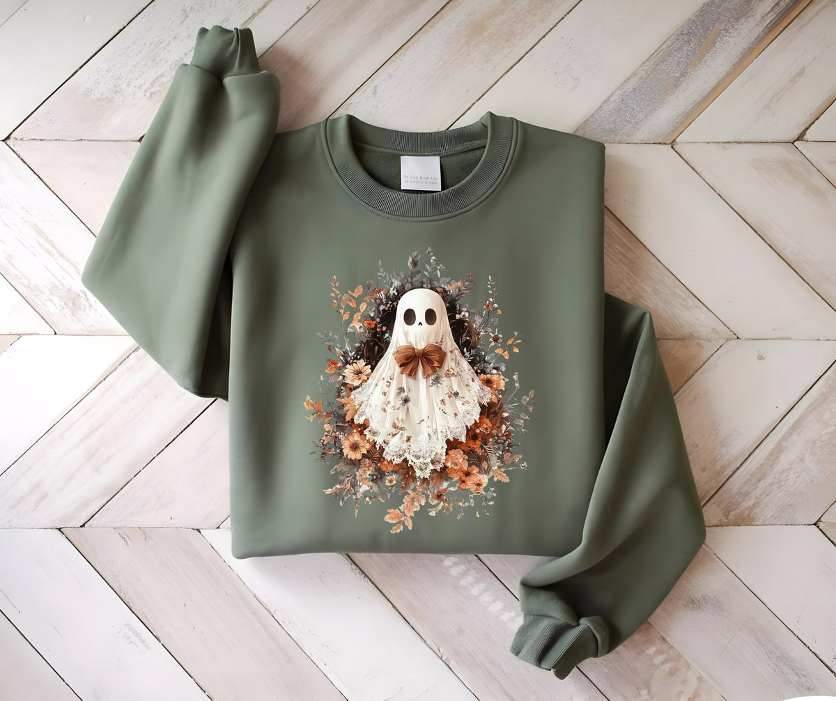 May include: Olive green sweatshirt featuring a ghost design with a floral wreath and a brown bow tie. The ghost has a white sheet with a lace trim. The sweatshirt has long sleeves and a crew neck.