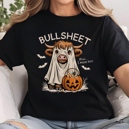 May include: Black t-shirt with a Halloween-themed graphic. The design features a cow dressed as a ghost with the text "BULLSHEET" above and "Moo... I mean boo" below. A jack-o'-lantern and bats complete the design.