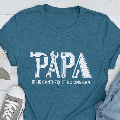 May include: Teal t-shirt with the word "PAPA" in white, using tool-themed letters. Below, the text reads "IF HE CAN'T FIX IT, NO ONE CAN". A hammer, wrench, saw, and other tools form the letters.