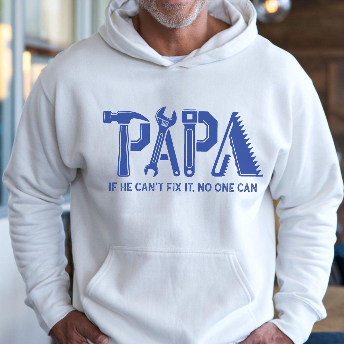 May include: White hoodie with a blue graphic that says "PAPA" with tools incorporated into the letters. The text "IF HE CAN'T FIX IT, NO ONE CAN" is below the word "PAPA".