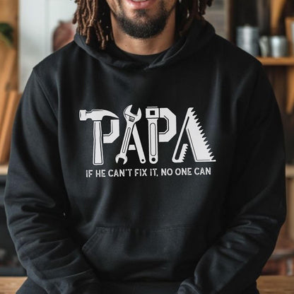 May include: Black hoodie with the word "PAPA" in white, with tool-themed letters. The text "IF HE CAN'T FIX IT, NO ONE CAN" is below the word "PAPA".