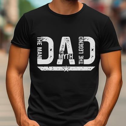 May include: Black t-shirt with a white graphic that reads "DAD The Man, The Myth, The Legend". The design includes a star and horizontal lines. The shirt is a crew neck.