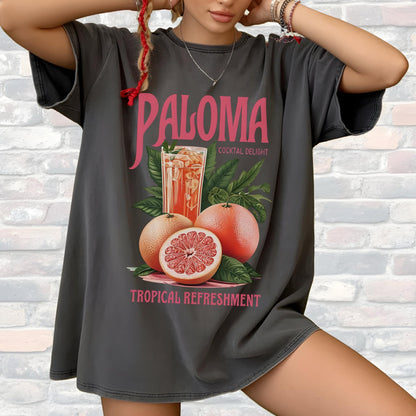 May include: Dark gray t-shirt with a graphic featuring the word "Paloma" in pink, a cocktail, grapefruits, and the words "Cocktail Delight" and "Tropical Refreshment".