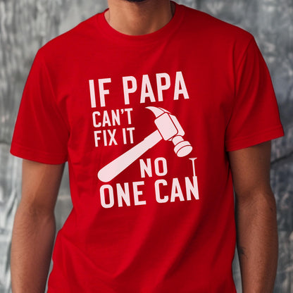 May include: Red t-shirt with the text "IF PAPA CAN'T FIX IT NO ONE CAN" in white. A white hammer graphic is featured in the center, with a nail. The shirt is made of a soft material.