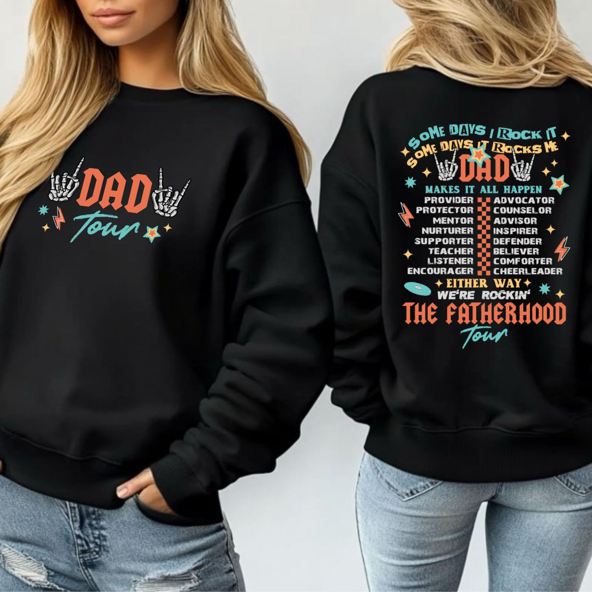 May include: Black sweatshirt with the text "DAD Tour" in orange and teal. The front features a skeleton hand graphic. The back of the sweatshirt has the text "Some days it rocks me, Dad" and a list of positive attributes.