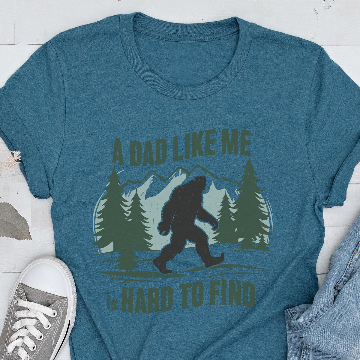 Funny Bigfoot Dad Shirt, A Dad Like Me Is Hard To Find Tee, Sasquatch Father’s Day Gift, Wilderness Dad T-Shirt, Forest Style Tees