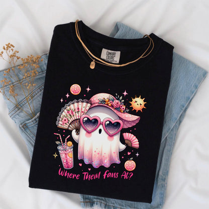 May include: Black t-shirt featuring a cartoon ghost wearing heart-shaped sunglasses, a pink hat, and holding a fan. The graphic includes a drink, sun, and the text "Where Them Fans At?" The shirt is folded on top of blue jeans.