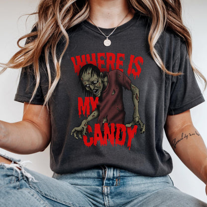 May include: Dark gray t-shirt featuring a zombie graphic with the text "WHERE IS MY CANDY" in red. The zombie is depicted in a red shirt with exposed flesh. The shirt is a casual, unisex style.