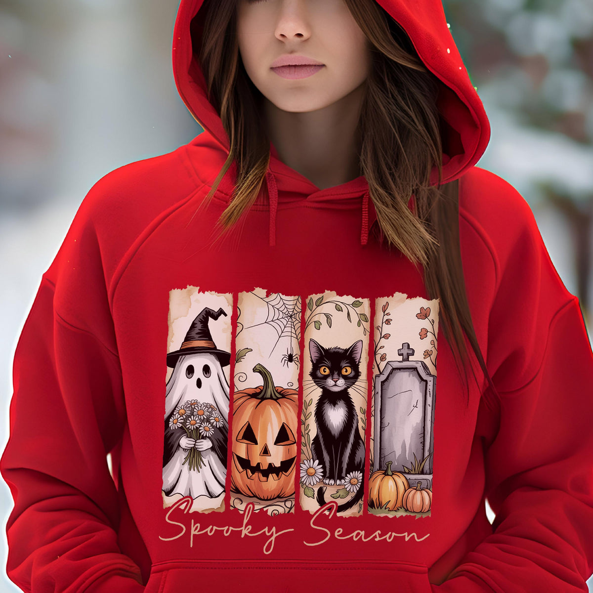 May include: A bright red hooded sweatshirt featuring a graphic print of four vertical panels. The panels display a ghost holding flowers, a jack-o'-lantern, a black cat, and a tombstone with pumpkins. The text Spooky Season is printed below.