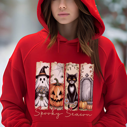 May include: A bright red hooded sweatshirt featuring a graphic print of four vertical panels. The panels display a ghost holding flowers, a jack-o'-lantern, a black cat, and a tombstone with pumpkins. The text Spooky Season is printed below.