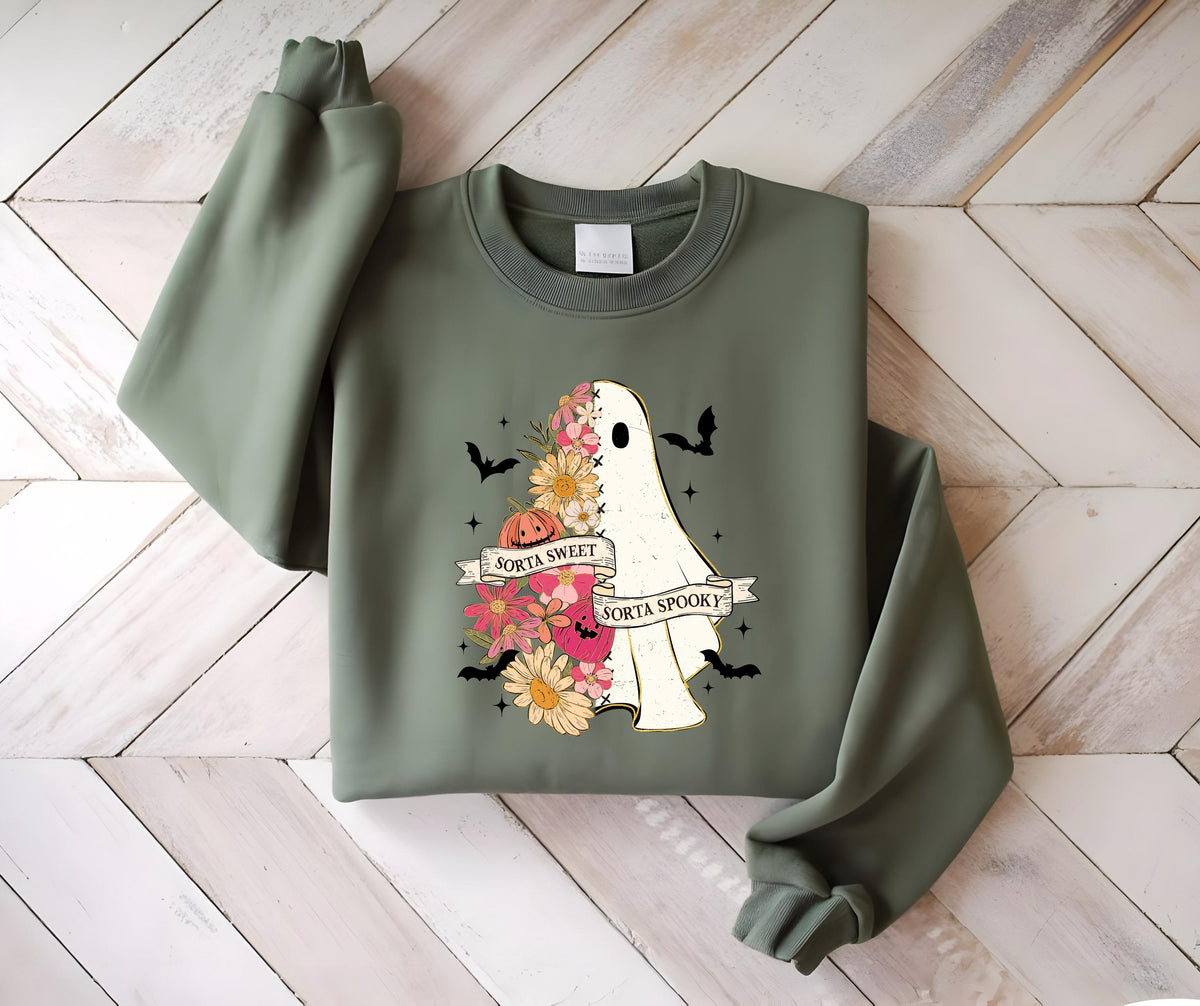 May include: Olive green sweatshirt featuring a ghost design with floral accents and the text "Sorta Sweet Sorta Spooky." The ghost is half-filled with flowers in shades of pink, orange, and yellow. Black bats and stars are scattered around the design.
