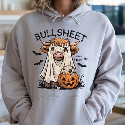 May include: A light gray hoodie featuring a Halloween-themed graphic. The graphic depicts a cow dressed as a ghost with the text "BULLSHEET" above and "Moo... I mean boo" next to it. A jack-o'-lantern and bats complete the design.