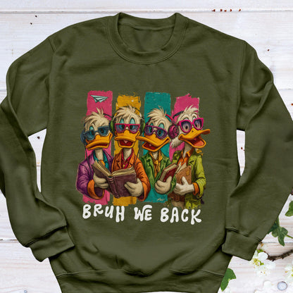 May include: An olive green sweatshirt featuring a cartoon illustration of four ducks wearing glasses and holding books. The ducks are set against colorful vertical stripes, with the text "BRUH WE BACK" in white.