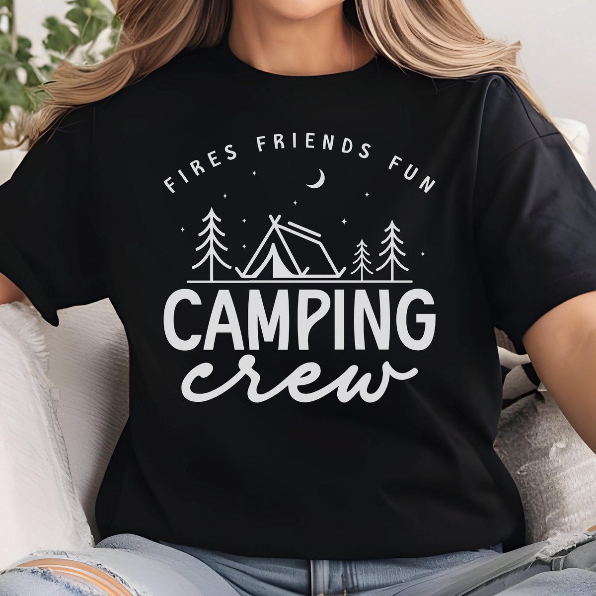 May include: Black t-shirt with a white graphic that reads "Fires Friends Fun" above a tent and trees, with the words "Camping Crew" below. The design evokes a camping theme.