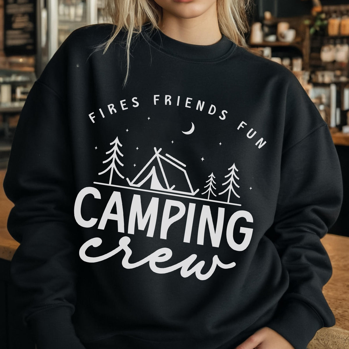 May include: Black sweatshirt with white text and graphics. The text reads "Fires Friends Fun" above a camping scene with a tent, trees, moon, and stars. Below, the text says "Camping Crew" in a cursive font.