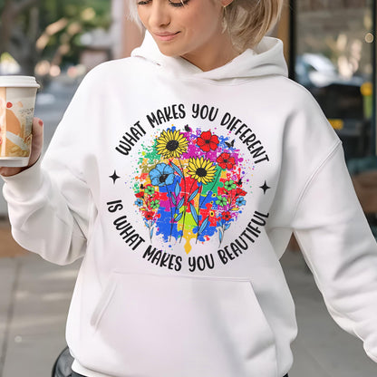 May include: White hoodie with a colorful floral design and the text "WHAT MAKES YOU DIFFERENT IS WHAT MAKES YOU BEAUTIFUL". The design features sunflowers, red flowers, and blue flowers. The hoodie has a front pocket.