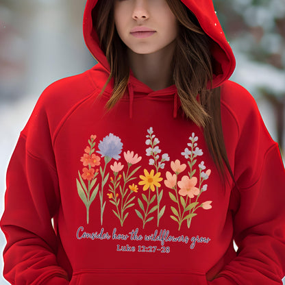 May include: A red hooded sweatshirt featuring a floral design with various colors. The design includes the text "Consider how the wildflowers grow" and "Luke 12:27-28". The sweatshirt is made of a soft material.