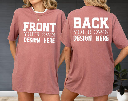 May include: A dusty rose-colored t-shirt with white text on the front that reads "FRONT YOUR OWN DESIGN HERE." The back of the shirt has the text "BACK YOUR OWN DESIGN HERE" in white. The shirt has short sleeves and a crew neck.