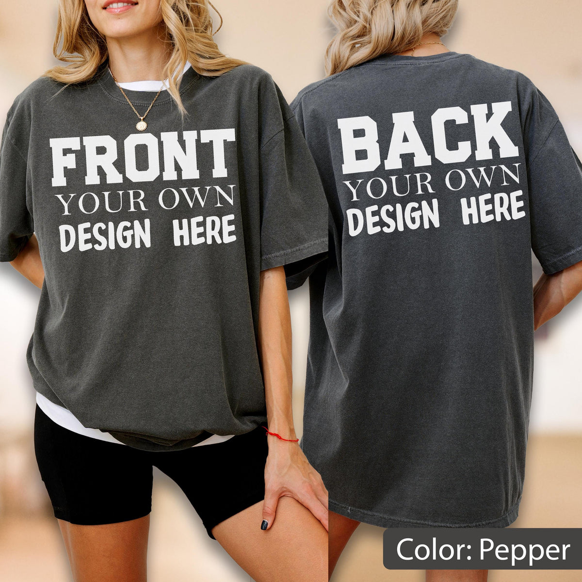 May include: Pepper-colored oversized t-shirt with the text "FRONT YOUR OWN DESIGN HERE" on the front and "BACK YOUR OWN DESIGN HERE" on the back. The shirt is a dark gray color and has a relaxed fit.
