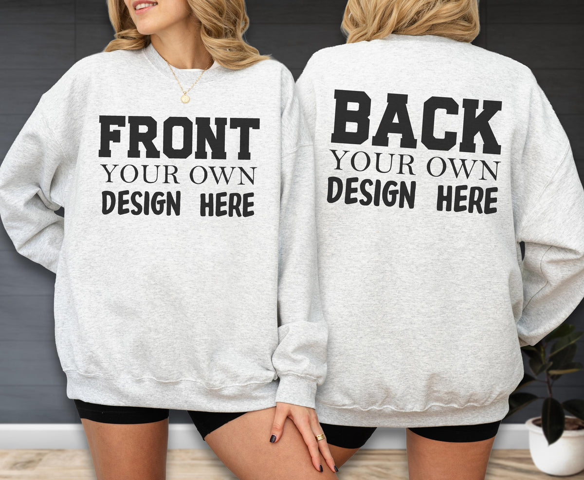 May include: Light gray sweatshirt with the text "FRONT YOUR OWN DESIGN HERE" on the front and "BACK YOUR OWN DESIGN HERE" on the back in bold black letters. The sweatshirt has long sleeves and a crew neck.