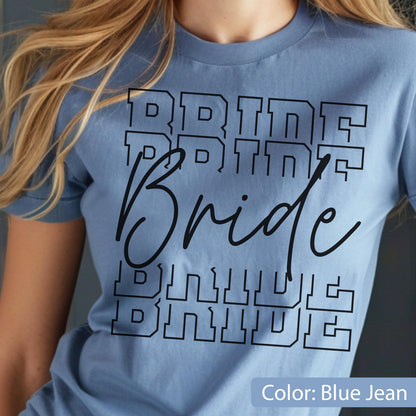 May include: A light blue t-shirt with the word "Bride" in a black, bold, layered font. The word is repeated multiple times. The shirt is a solid color and has short sleeves.