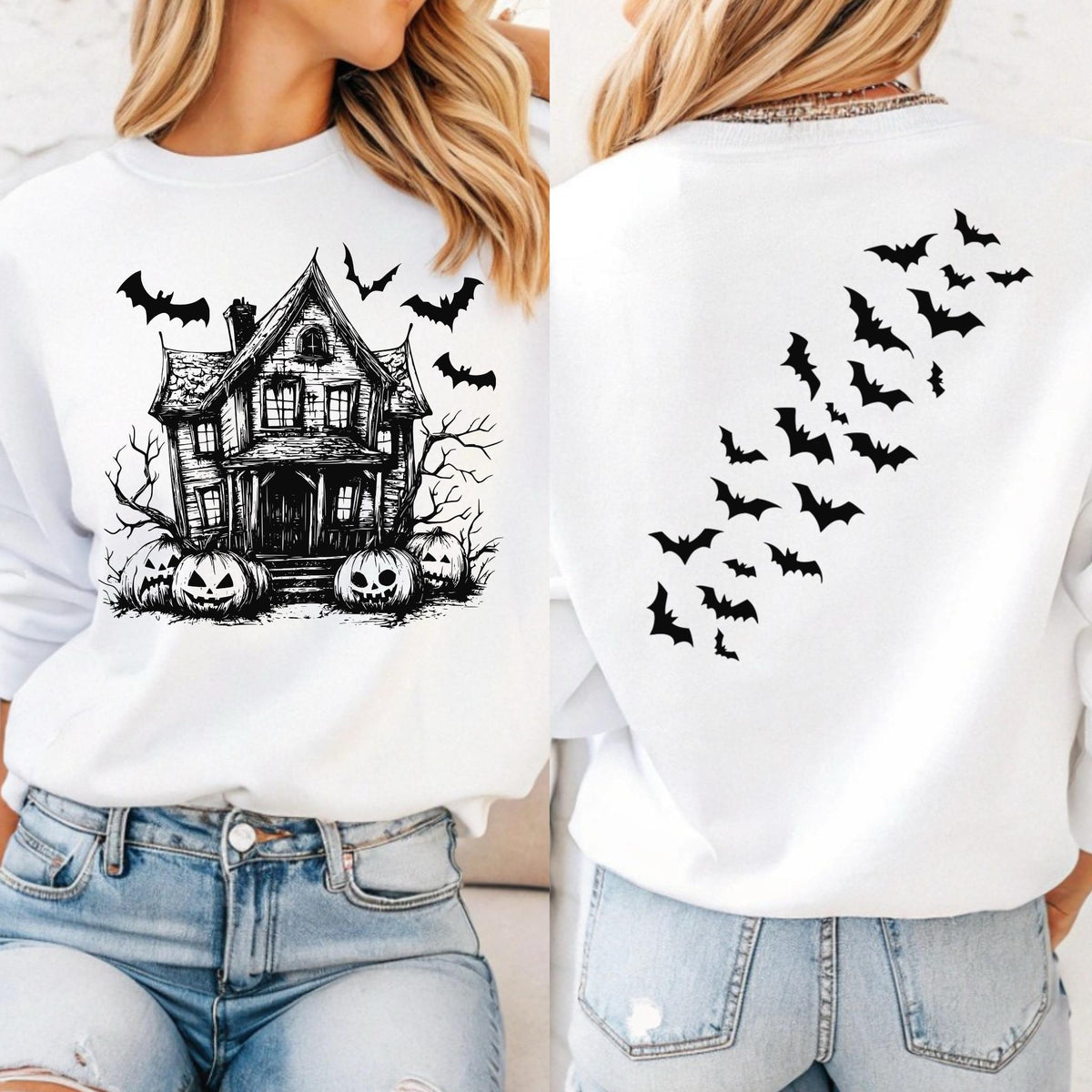 May include: White sweatshirt featuring a black and white haunted house graphic with pumpkins and bats. The back of the sweatshirt has a design of bats in flight. A Halloween-themed apparel item.