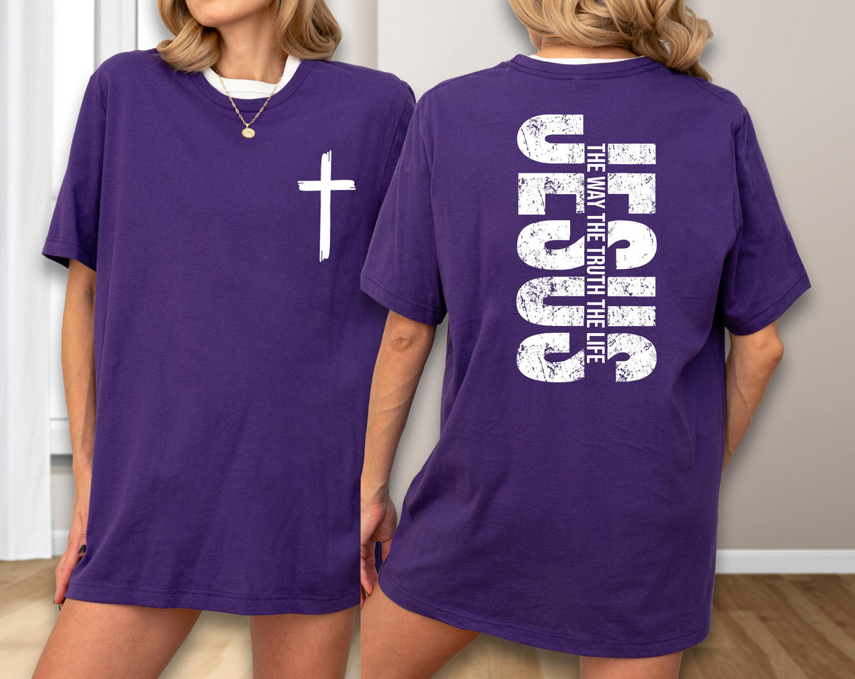 May include: A purple t-shirt with a white cross on the front and the text "JESUS THE WAY THE TRUTH THE LIFE" on the back. The shirt has a white collar and a relaxed fit.